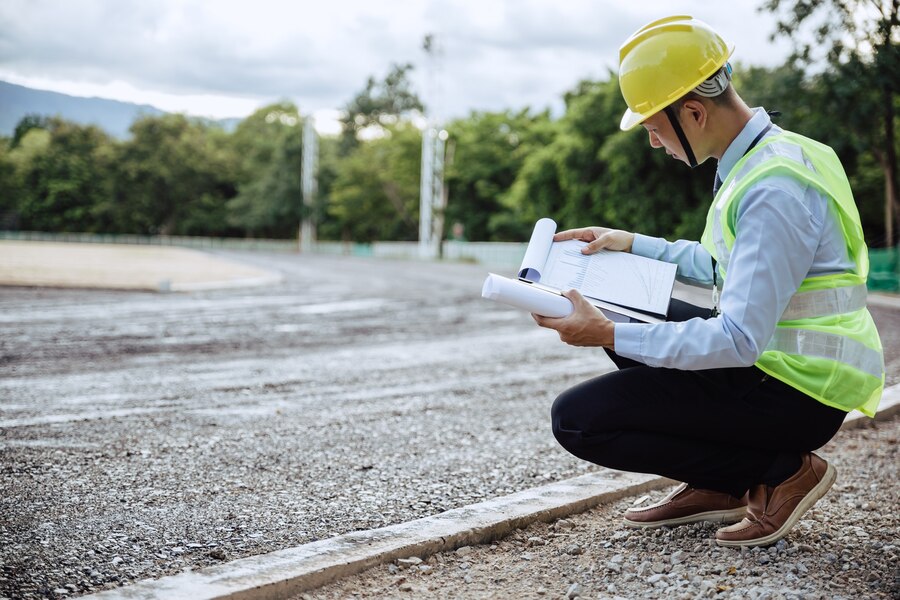 asian-engineer-looking-blue-printed-building-structure-worker-get-social-security-insurance-labor-day-success-business-concept_112554-652